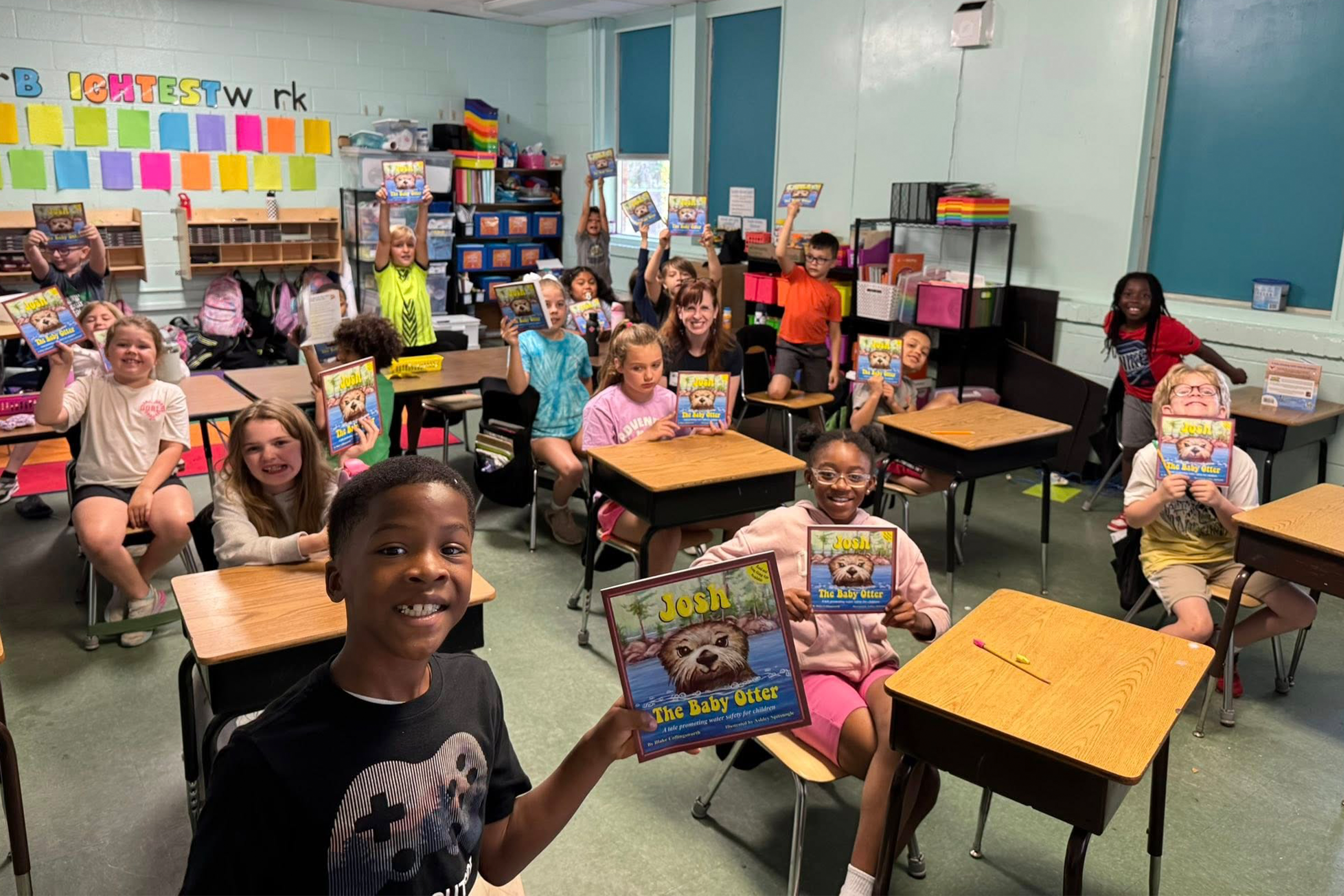 Summerville Rotary members reading to students in a classroom